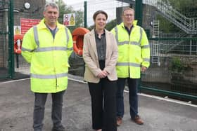 Minister Kimmins is pictured at the recently installed flood gate on the River Lagan at Hilden with DFI Rivers engineers Mark Scott and Owen McGivern. Pic credit: DfI