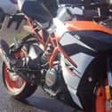 The stolen black and orange KTM RC390 motorbike. Picture: released by PSNI