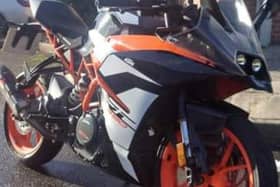 The stolen black and orange KTM RC390 motorbike. Picture: released by PSNI