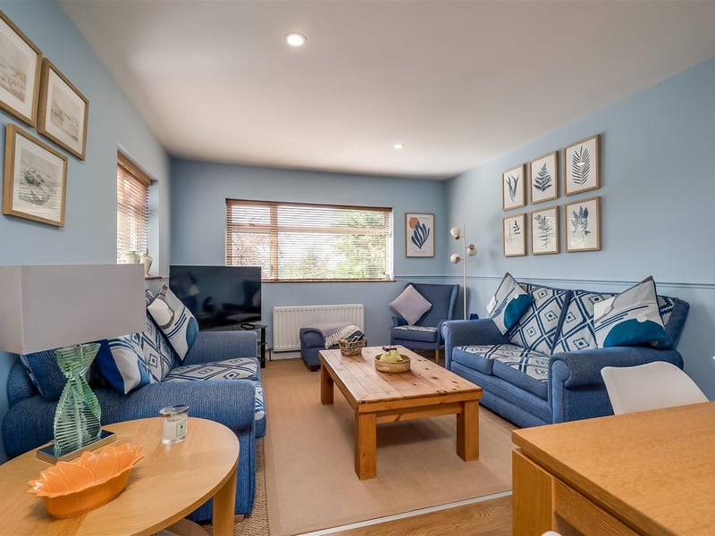 Family room with dual aspect windows.