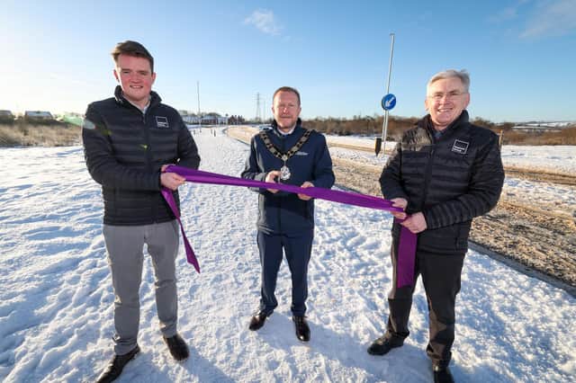 Shane Cooke (Property Director) and Eamonn Burns (Construction Director of Neptune Group), are joined by the Mayor of Antrim and Newtownabbey, Ald Stephen Ross, to officially open the Ballyclare Relief Road