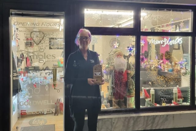 Gillian Knight pictured with the wining trophy for Garvagh, Angles Hair Designs impressed the judges with their traditional Father Christmas display.