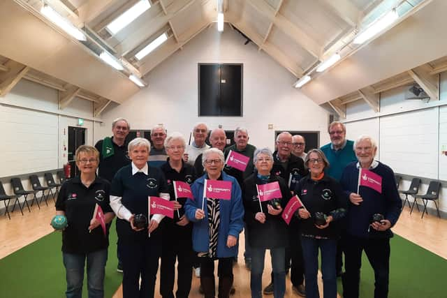 Patricia McConnell (centre), chairperson of Carnlough Community Association, with committee and bowling club members