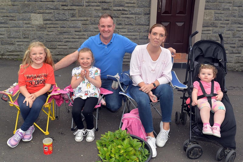 Enjoying the Mavemacullen Accordion Band 70th anniversary parade in Markethill on Wednesday are members of the Gillespie family including from left, Sophie (6), Ella (4), dad Darren, mum Suzanne and Hannah (1). PT32-230.