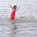 Twins Ellie and Eireann enjoying the weather at Lough Shore Park in Antrim.