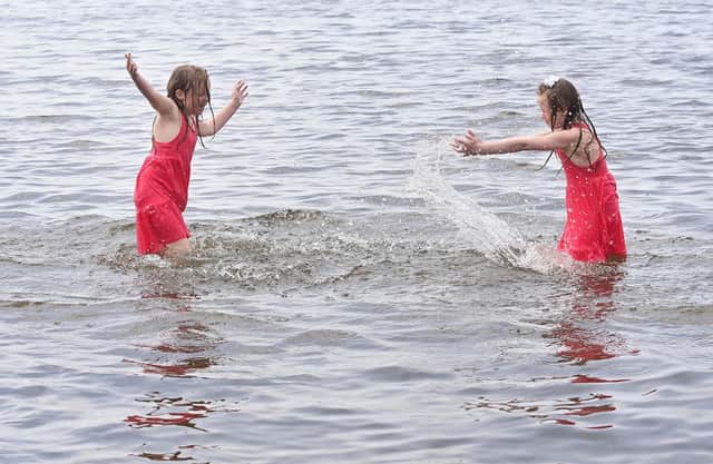 Twins Ellie and Eireann enjoying the weather at Lough Shore Park in Antrim.