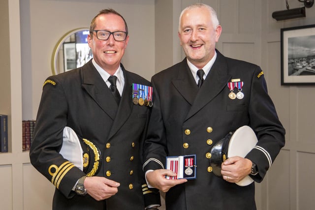 Ballycastle Coastguard CRO Gareth McKellar receives his H.M. Coastguard Long Service and Good Conduct Medal for 20 years' service from Rob Stevenson, Coastal Operations Area Commander for area 16