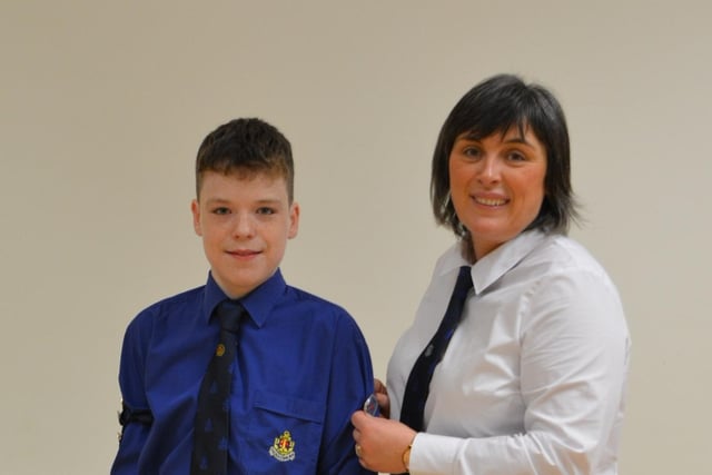 Ross McAleese with his mother Laura presenting him with his President's badge.
