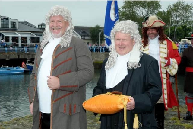 David Hilditch (left) taking part in a King William Landing pageant in Carrickfergus. Photo: National World