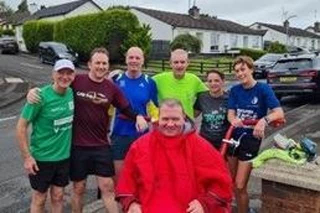 Francis Stewart pictured with members of Team Francis who will be pushing him around the Dublin Marathon course to raise money for two charities. Credit: Contributed