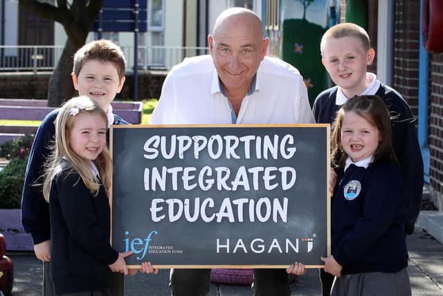 James Hagan with Harris Inch, Aiden Wilson, Lily Lowry and Faith Millar from Central Integrated Primary School, Carrickfergus. Photograph by Declan Roughan