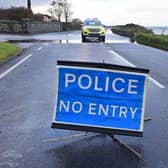 Police at the Coast Road on Friday following a landslide which made a stretch of the route impassable. Picture: Colm Lenaghan / Pacemaker Photo