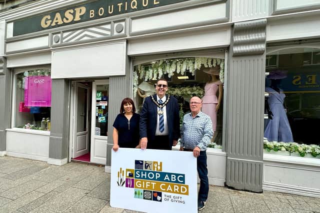 Lord Mayor, Alderman Stephen Moutray with Armagh business owners who have signed up for the gift card scheme - Ann Doyle from Gasp Boutique and Dessie Feeney from Dessie’s Clothing.