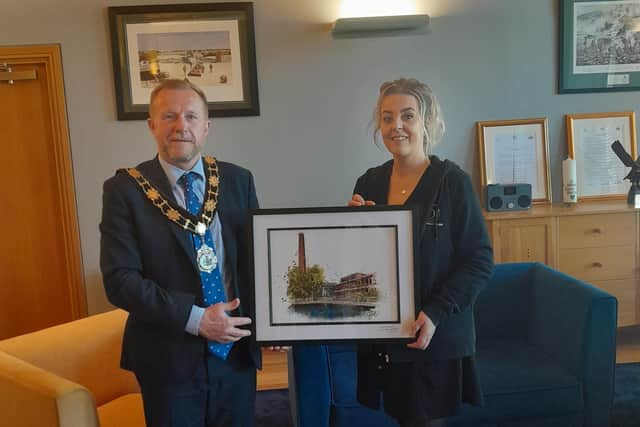 Dionne Pollock presents the Mayor of Antrim and Newtownabbey, Ald Stephen Ross, with a digital print of Mossley Mill.