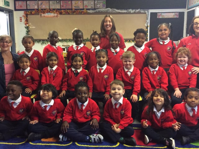 Mrs Metcalfe's P1 class at Presentation Primary School pictured with classroom assistants Mrs Woolsey and Mrs Adamson.