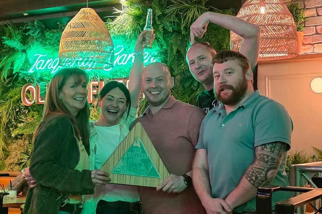 Winning team Never U F’n Mind with organiser Bill Buchanan.  Photo: Déjà Vu Promotions
