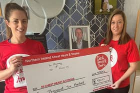 NICHS Community Fundraiser, Ali Patterson, receiving a cheque for £5600 from Mary Coyle. Credit: NICHS