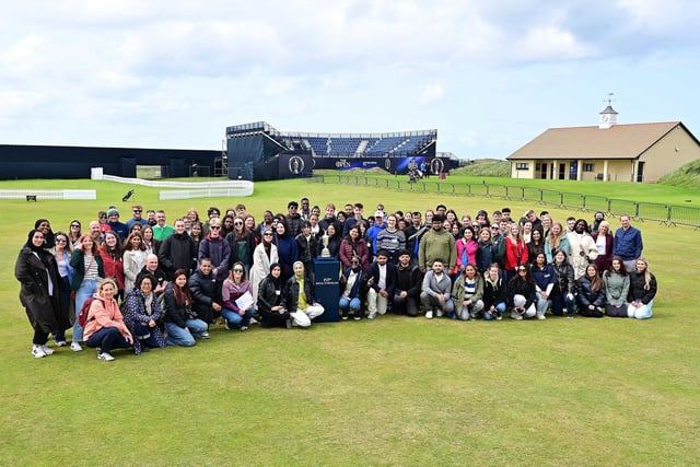Students from Ulster University, University of Liverpool, Manchester Metropolitan, and Berlin School of Economics and Law gather at Royal Portrush Gofl Club with the iconic Claret Jug and backdrop of The 153rd Open. Part of the Sustainable Innovation Challenge, hosted by UU and supported by The R&A, the two-day event empowered students to create bold ideas for a greener future in sport.