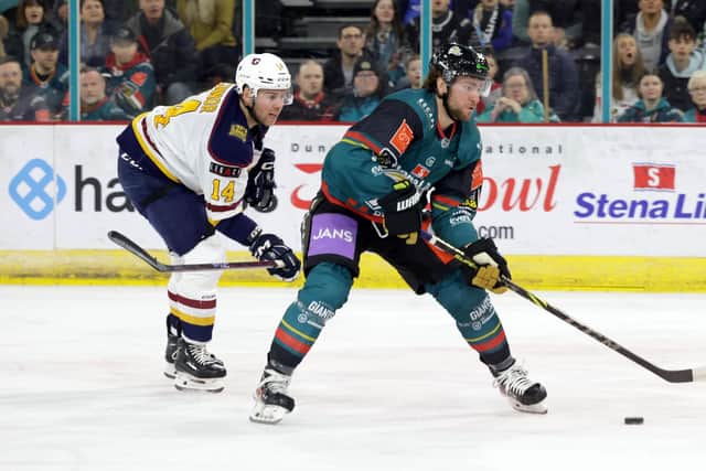 Belfast Giants' #12 Grant Cooper in action against the Guildford Flames