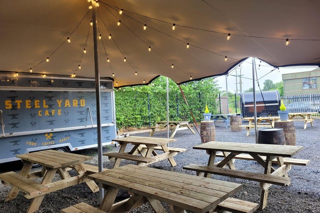 Steelyard Cafe is a unique street food and pizza spot in Ballymoney, Co Antrim. A hidden gem, it features a funky outdoor dining space surrounded by shipping containers and a food truck. Steelyard serves a variety of options, including pizza, buttermilk chicken burgers, coffee, and sweet treats. Enjoy your meal in their outdoor dining area, especially on sunny days. Find them here: www.facebook.com/steelyardcafe