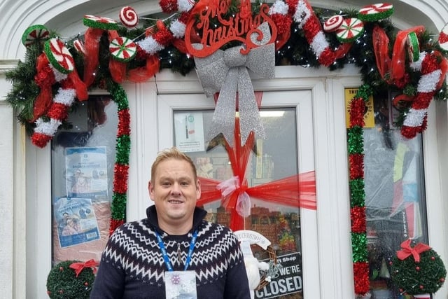 Jasper’s Gift Shop Portrush staff member shows off their festive décor