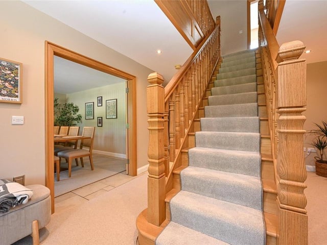 Bright, spacious and elegant entrance hall with a solid oak central staircase.