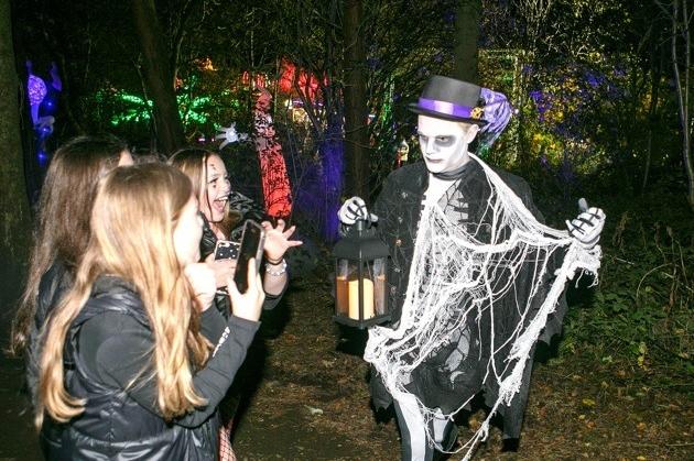 Residents enjoying the spooky trail on Halloween night.