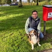 Ballymoney councillor Lee Kane, alongside Ruby, has welcomed the replacement dog waste bin. Credit Lee Kane