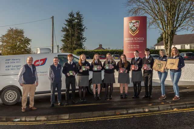 Pictured handing over the Meat4Schools hamper is (L-R) Hugh McGahan, ABP, Alan Wilson, ABP Linden, the winning pupils from Dalriada School, Sarah Toland, LMC education and consumer promotions manager and Jo-Anne McCay, LMC marketing placement student. Credit Chris Neely