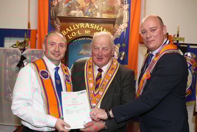 Bro Robert Duff LOL 431 receiving his certificate from the Grand Master & Worshipful Master LOL 431.and David Keers