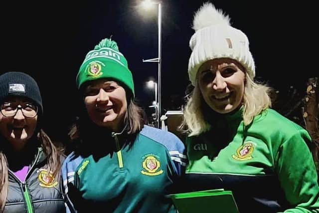 Sarsfields volunteers out canvassing the Derrytrasna area of Co Armagh with invitations to a meeting to plan for the Centenary of Sarsfields GAA Club.