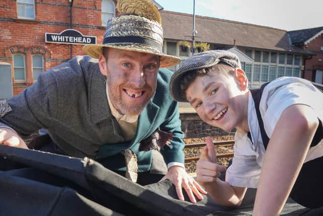 Victorian chimney sweeps Ryan Moffett and Ethan Kells encourage visitors to take the train to Whitehead Victorian Street Fair on November 26.