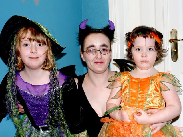 Lorna McBride with her two children, Rachel and Rhianna, at a Halloween party in the Park Orange Hall, Armoy, in 2006.