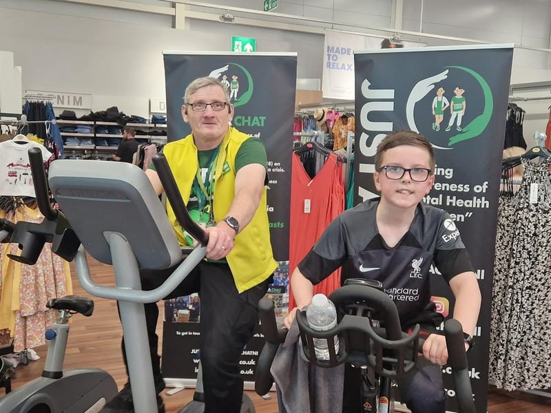 Young man and older man both join the team to cycle 282 miles at Asda in Portadown in order to raise money for local charity, Just A Chat, which was set up to raise awareness and combat the stigma of mental health for youths.