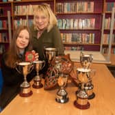 Proud mum...Judith Crowe poses happily with her daughter, Molly who picked up eight awards at the Tandragee Junior High school Prize Day. PT44-240.