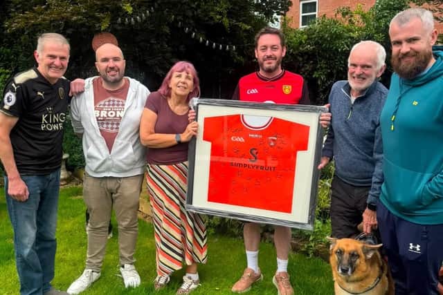 The family of Natalie McNally were presented with a signed GAA jersey of Ulster Champions Armagh by Down supporter Willie Quinn. The shirt was won at a charity auction in the Irish National Foresters in Lurgan in aid of Daire Rooney's journey to Arizona for stem cell treatment.