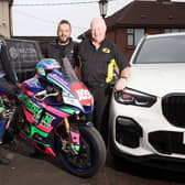 Hilton Car Sales, Ballymena, is returning as a sponsor of the Armoy Road Races for the fifth year. Pictured are, from left, Neil Kernohan, motorcycle road racer, Andy Hilton, owner of Hilton Car Sales and William Munnis, Armoy Motorcycle Road Racing Club Chairman and Clerk of Course. Picture: Pacemaker