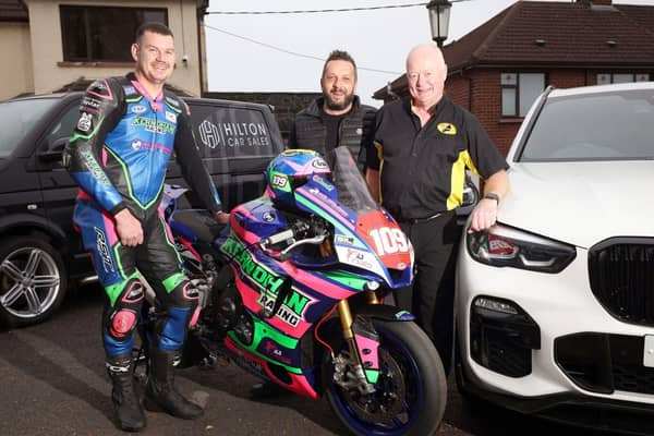Hilton Car Sales, Ballymena, is returning as a sponsor of the Armoy Road Races for the fifth year. Pictured are, from left, Neil Kernohan, motorcycle road racer, Andy Hilton, owner of Hilton Car Sales and William Munnis, Armoy Motorcycle Road Racing Club Chairman and Clerk of Course. Picture: Pacemaker