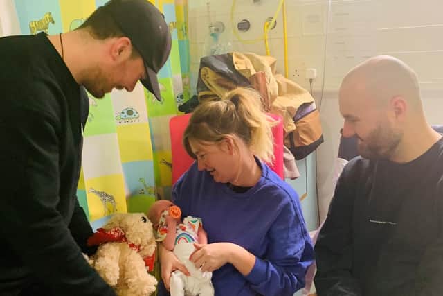 Giants player Josh Roach with parents Amy and Tom and baby Eliza Tabori. Pic credit: SEHSCT