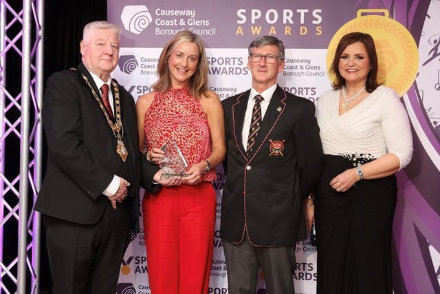 International Award winner Hannah Scott was unable to attend the Sports Awards in person. Accepting the award on her behalf is her mother Sharon Scott and Geoff Bones (coach at Bann Rowing Club), pictured alongside host Denise Watson and Mayor of Causeway Coast and Glens, Councillor Steven Callaghan.