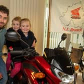All smiles at the bike show from Conor Anderson and daughters Zahra (4) and Grace (5). PT05-209.