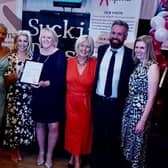 Members of the HR team collecting their award.