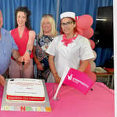 Pictured at the cutting of a special celebration cake to mark the awarding of over £250K in funding for Richmount Rural Community Association by The National Lottery Community Fund are from left, Ayten Hasanova; Joe Garvey, chairman of the community association, Ciara Duffy, TNLCF,;Martelle McPartland, association activities co-ordinator and Fatme Mehmedova. PT25-221. Credit: Tony Hendron