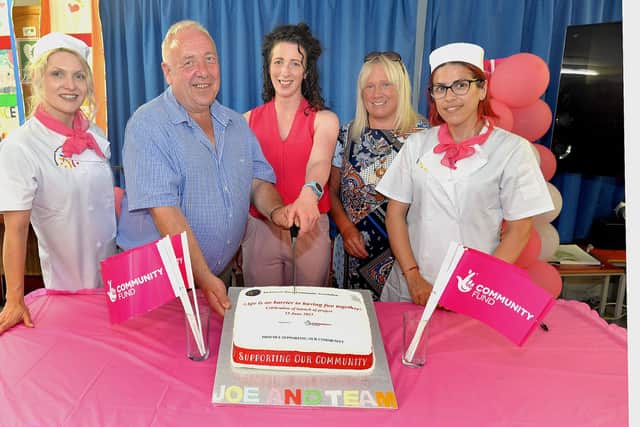Pictured at the cutting of a special celebration cake to mark the awarding of over £250K in funding for Richmount Rural Community Association by The National Lottery Community Fund are from left, Ayten Hasanova; Joe Garvey, chairman of the community association, Ciara Duffy, TNLCF,;Martelle McPartland, association activities co-ordinator and Fatme Mehmedova. PT25-221. Credit: Tony Hendron