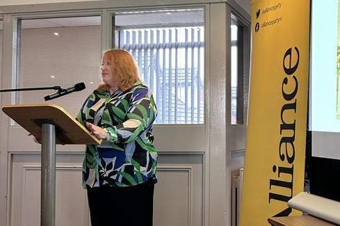 Party leader Naomi Long addressing guests and party members at the business breakfast.