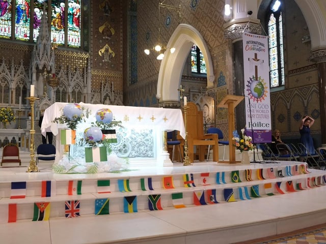 Flags from across the globe adorn the altar at St Peter's Church in Lurgan, Co Armagh for the International Mass on Sunday.