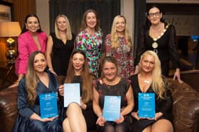 Top Row (L–R): Compere Rebecca McKinney; Katie McLean, Linencare; Lorraine Goodman, Bunzl Rafferty Guest Amenities; Suzi McIlhatton, Tourism Northern Ireland; and NIHF President Vicky Green. Bottom Row (L–R): Winners across the hotel categories: Belmore Court & Motel (Hotels with Under 75 Rooms); Titanic Hotel Belfast (Hotels with 75–149 Rooms); Holiday Inn Belfast (Hotels with 150 Rooms and Over); and Neringa Deikute, Slieve Donard (Housekeeper of the Year).