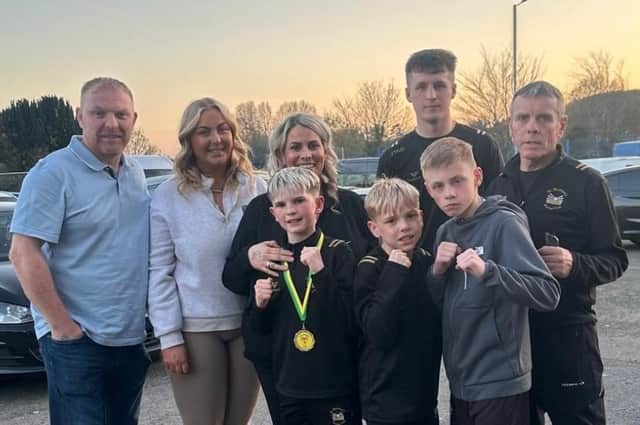 Oisin Murphy Markey, the champion, with his family and coaches James McGuinness and Owen Murphy.