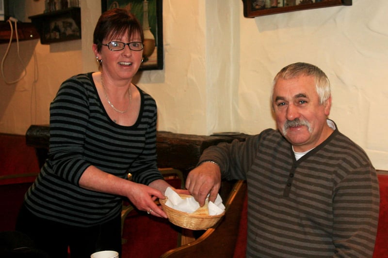 John McCook gets ready for a big fry up at the Rooks Nest in Armoy in 2009 courtesy of a hard working team of ladies who were raising funds for the Park Flute Band. Serving up the toast is Karen McCook