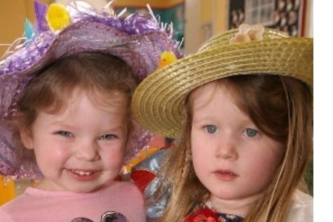 Zoe Hopper and Katie Temples with their Easter Bonnets at the Mulberry Bush Playgroup party in 2014.